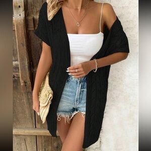 NWOT short sleeved black open cardigan sweater with side slits
